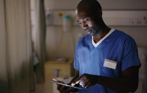 Shot of a medical practitioner using a digital tablet in a hospital ward