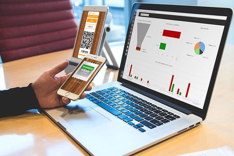 Photo of a person holding a phone with the Coupon Tools app