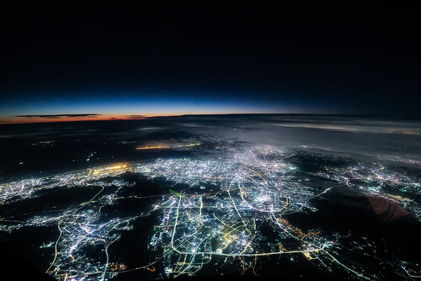 View of one side of the earth at night with lights lit up